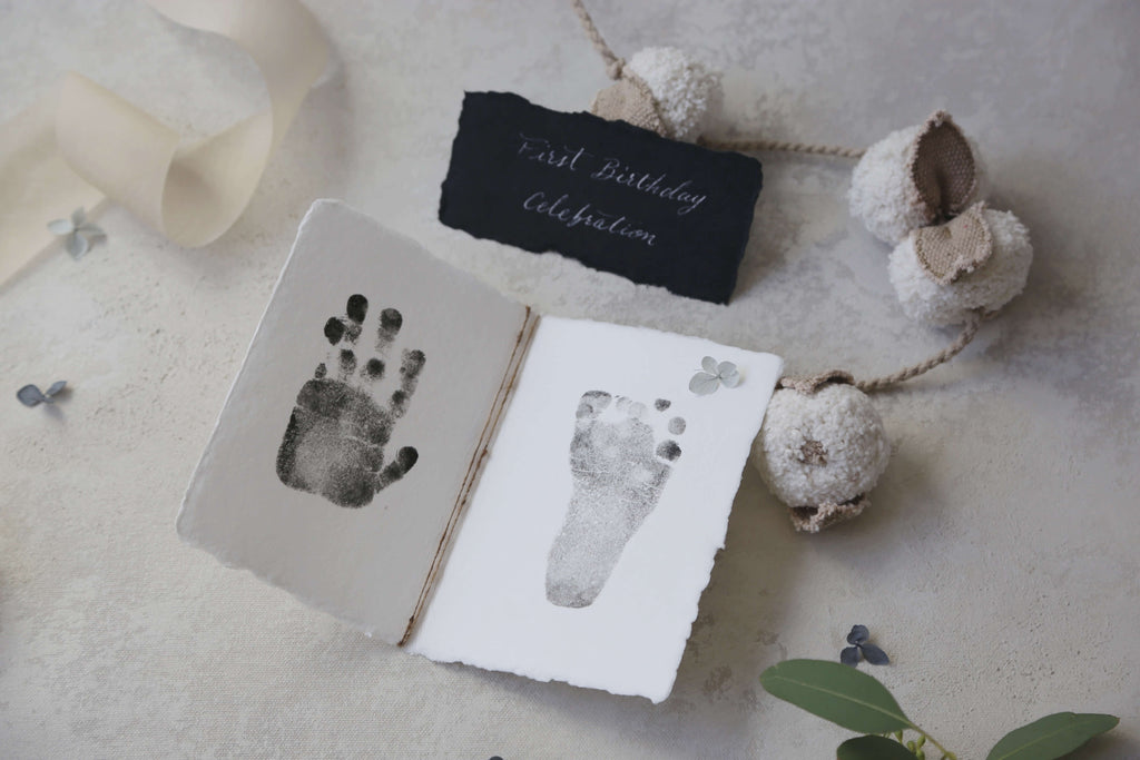 baby hand and foot print on handmade paper with natural silk twine